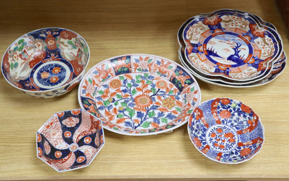 A Japanese Imari oval dish with six-character mark to base and six other items of Japanese Imari